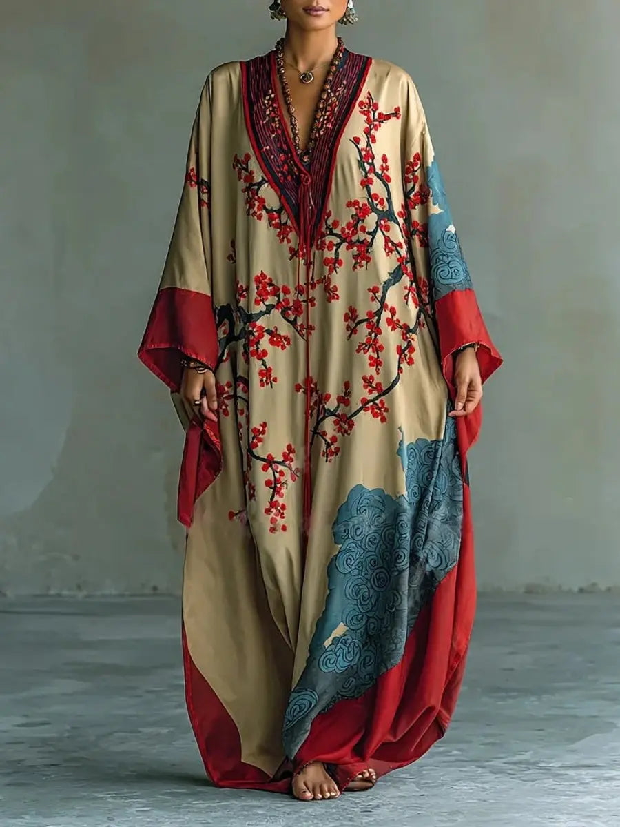 Women's floral batwing sleeve maxi dress in kimono style with vibrant plum blossoms, perfect for boho chic outfits.