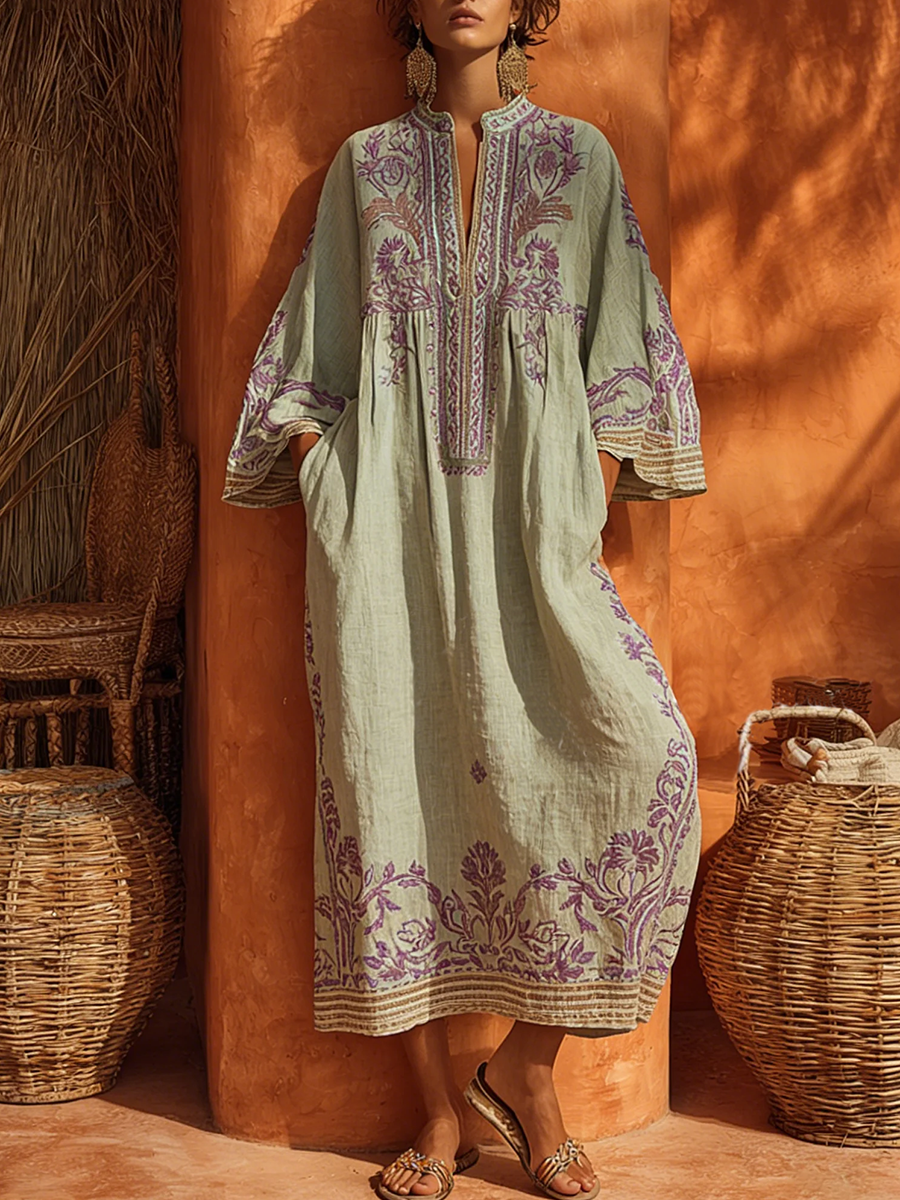 Flowy women's bohemian long sleeve floral maxi dress, casual summer style with mandarin collar detail.