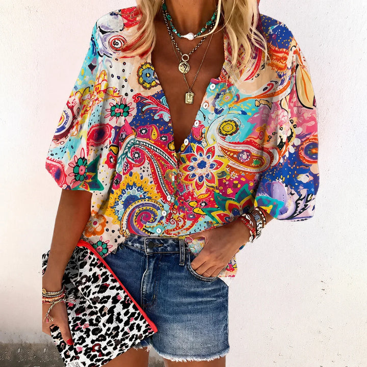 Bohemian women's floral print V-neck blouse with 3/4 sleeves, ideal for casual spring & summer outfits.