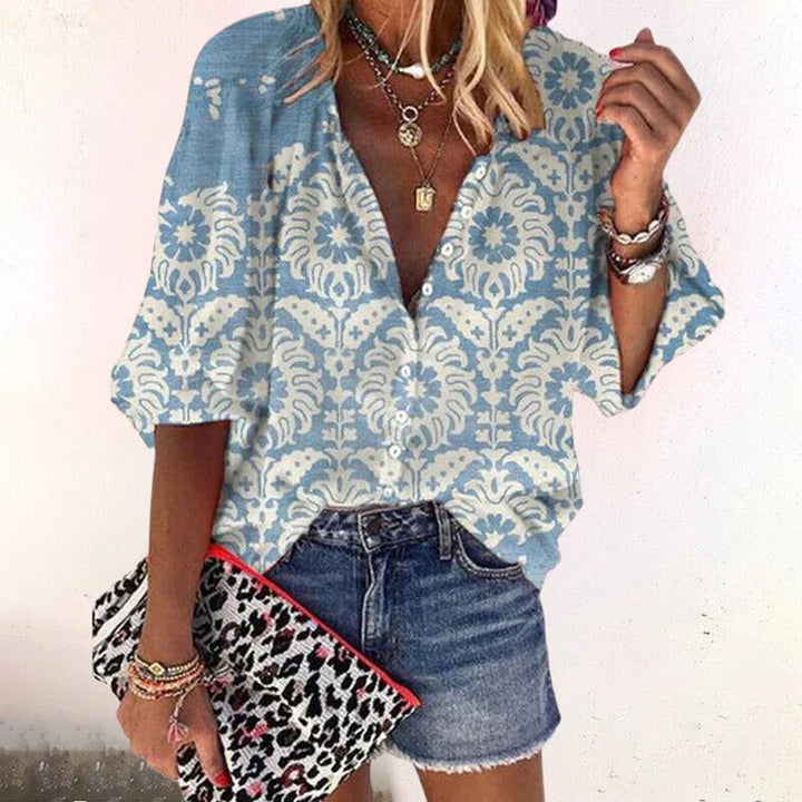 Stylish women's floral boho V-neck blouse with 3/4 sleeves, a versatile casual top for spring & summer days.