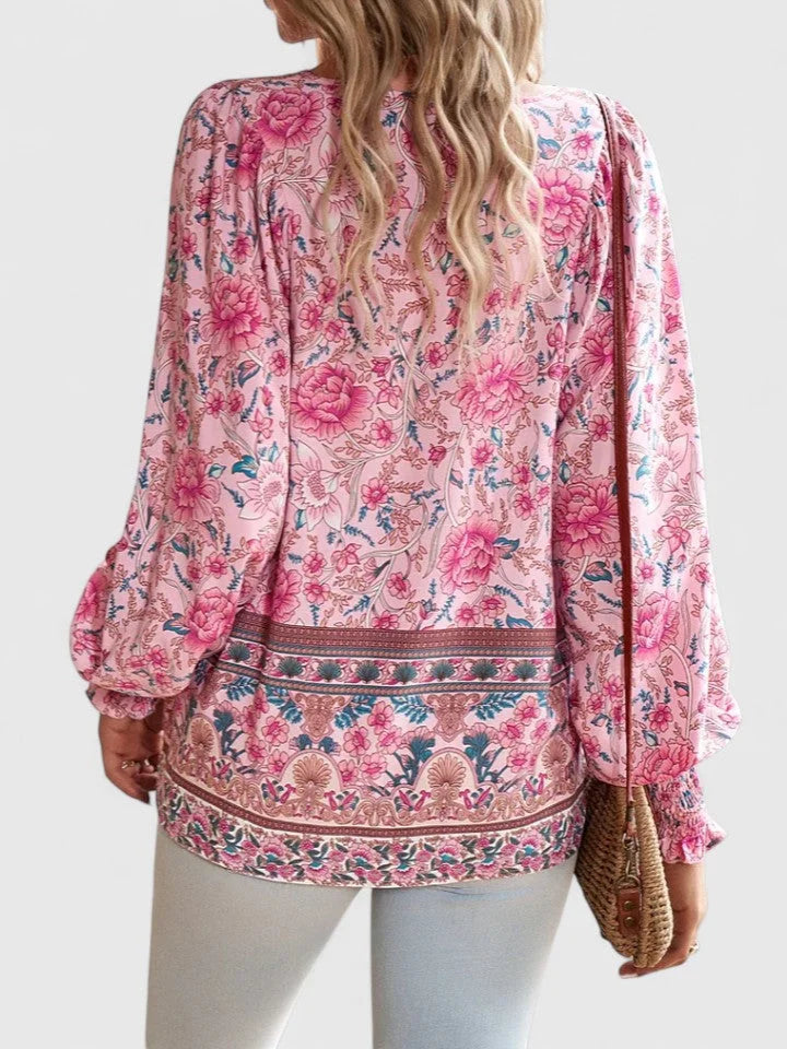 Versatile women's floral top with V-neck tie, smocked puff sleeves, and a chic, trendy style.