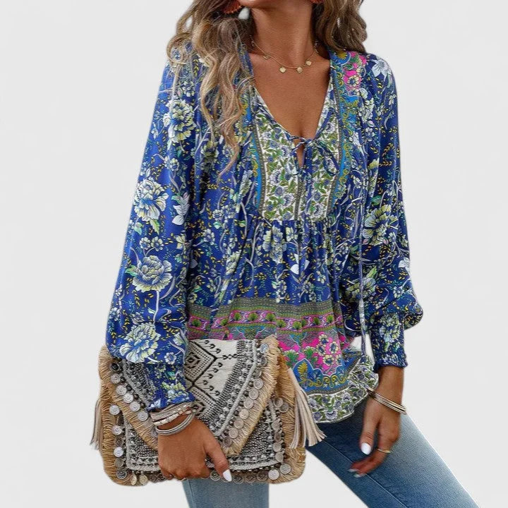 Bohemian floral print top for women, featuring a V-neck tie and stylish smocked puff sleeves.