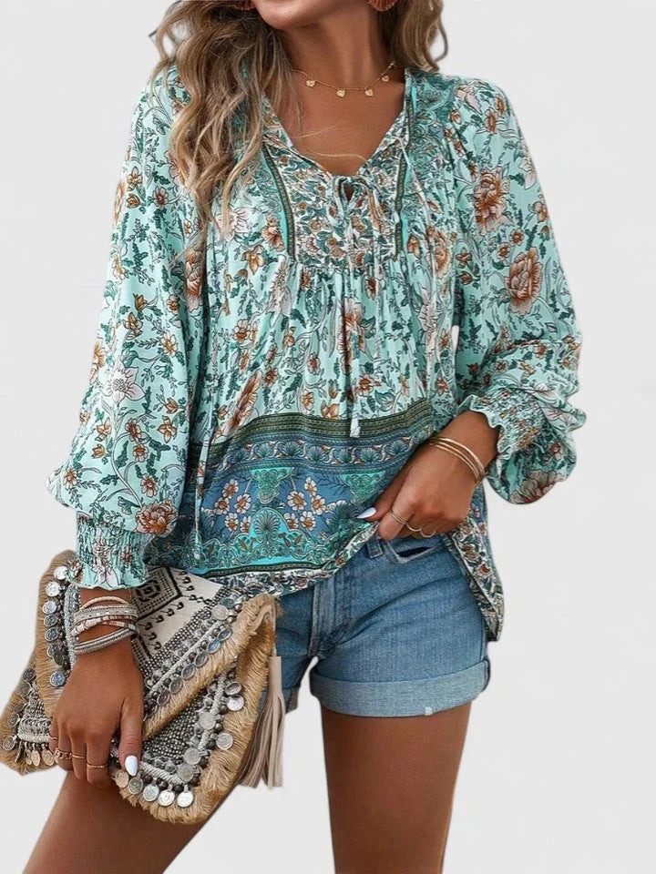 Casual floral smocked puff sleeve V-neck blouse for women's fashion, a relaxed fit top.