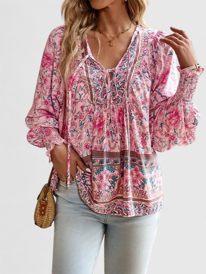 Botanical print V-neck women's blouse, featuring smocked puff sleeves and a bohemian style.
