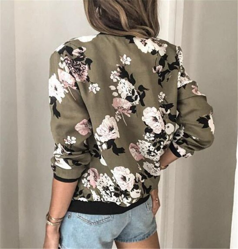 Trendy women's floral print bomber jacket, zip-front closure. Ideal lightweight outerwear for casual everyday wear.