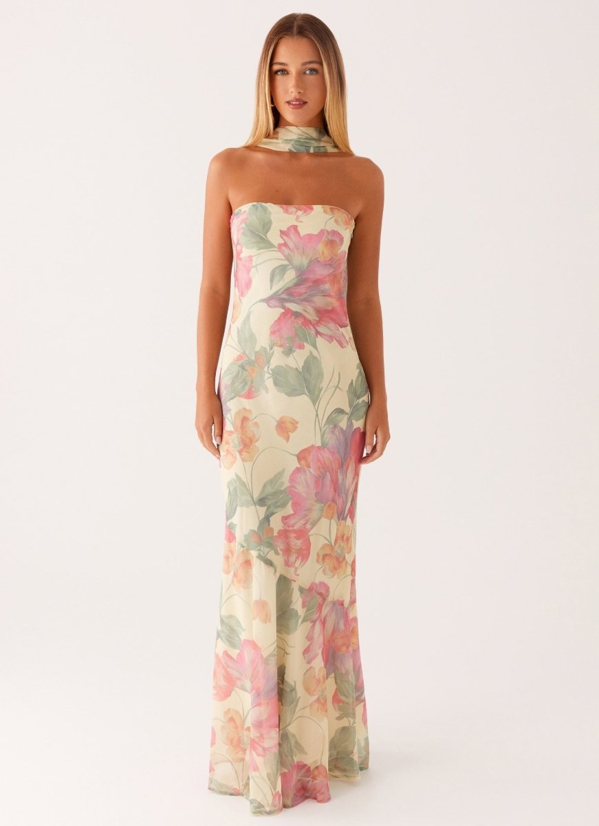 Stunning floral cold-shoulder maxi dress, ideal wedding guest or summer party attire. Flowing and elegant.