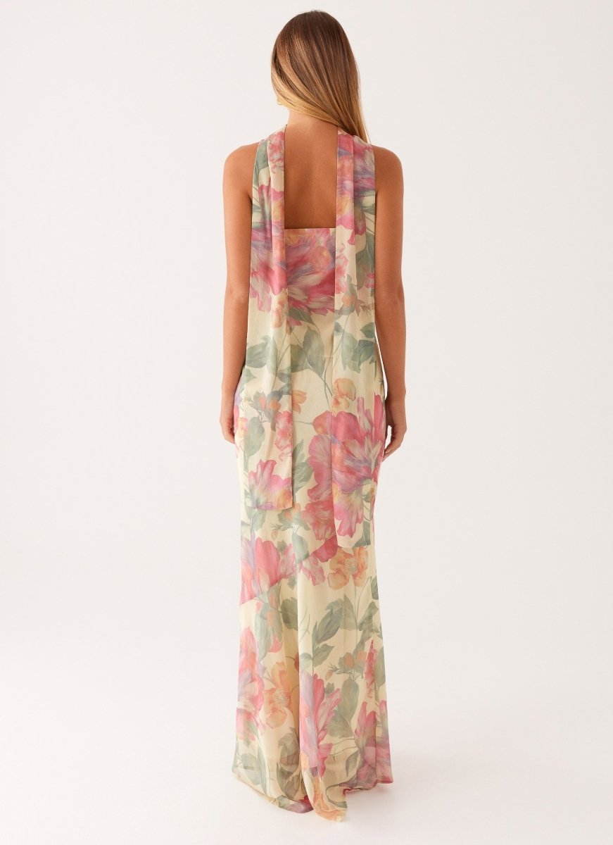 Flowing floral cold-shoulder maxi dress, a romantic halter neck design perfect for elegant summer events.