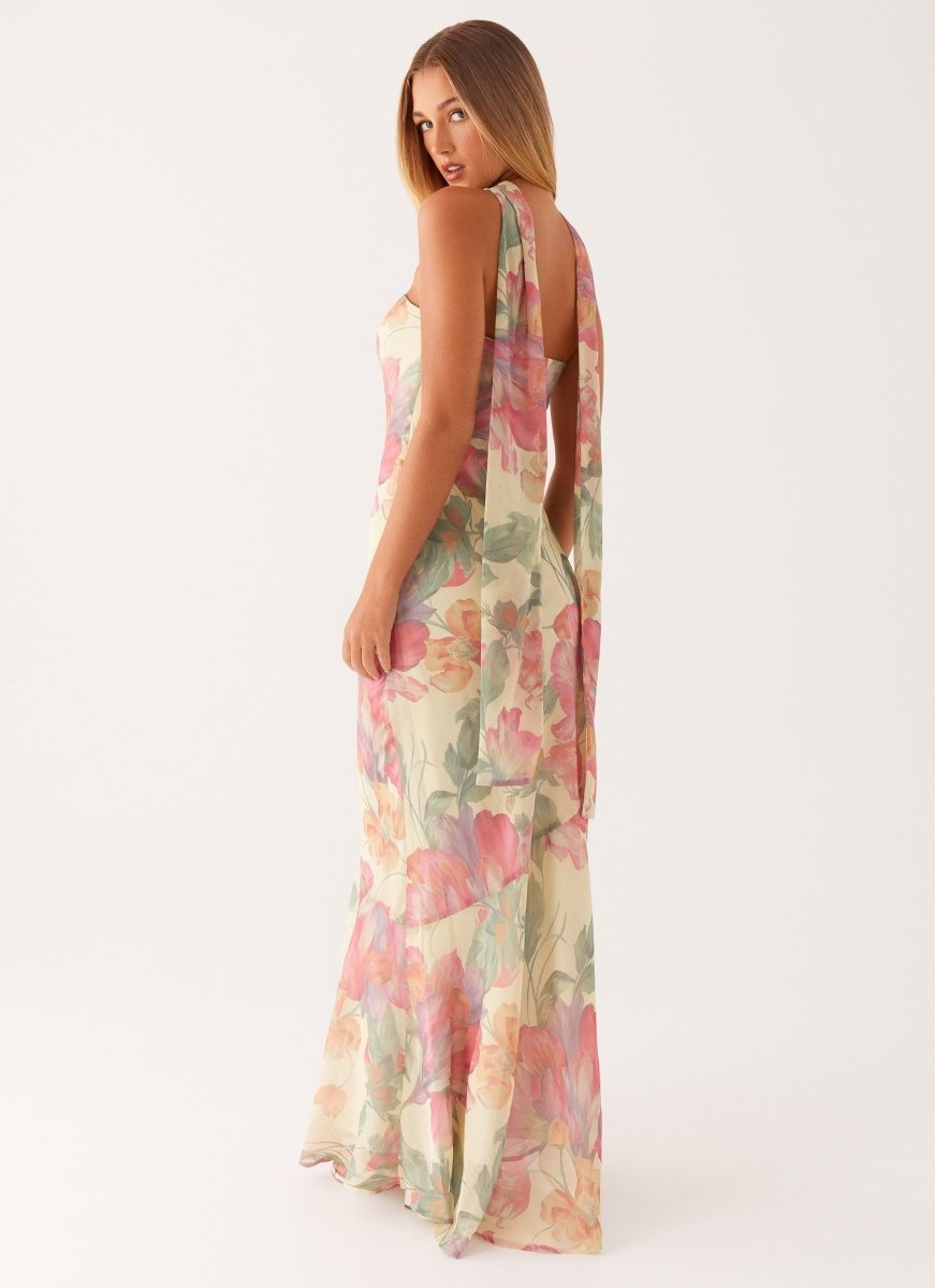 Women's halter V-neck floral maxi dress featuring stylish cold-shoulder detail. Perfect for romantic summer occasions.