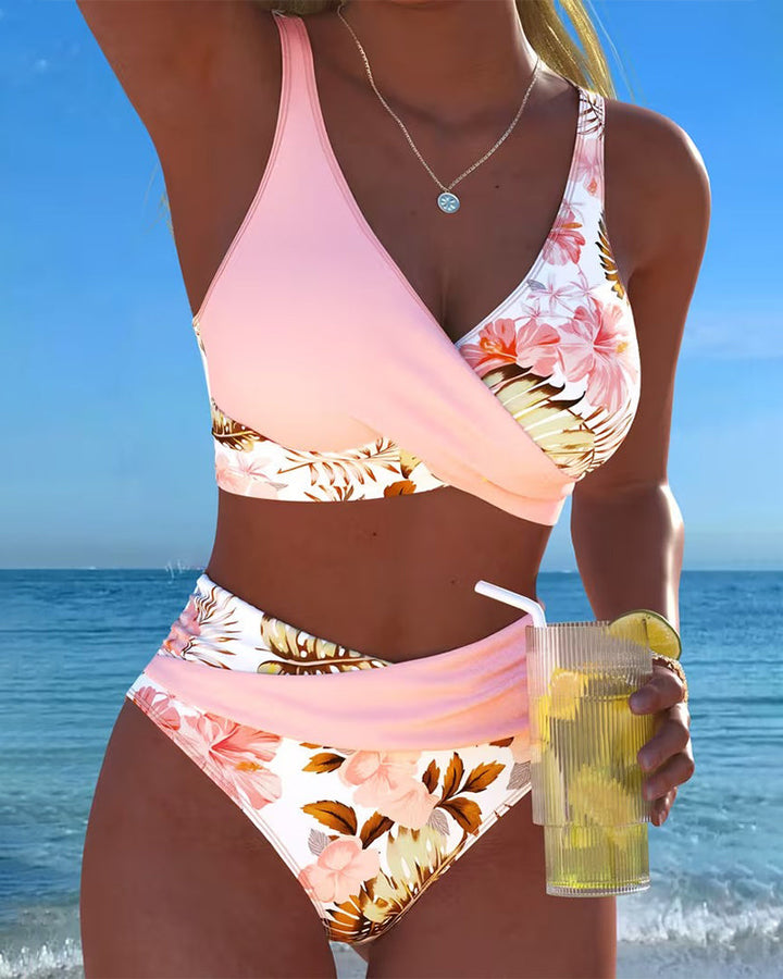 Women's floral cut-out high-waisted bikini set, perfect for stylish summer beachwear & poolside fashion.