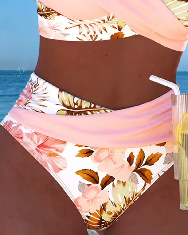 Stylish high-waisted floral print bikini with trendy cut-out design. Feminine two-piece swimsuit for women.