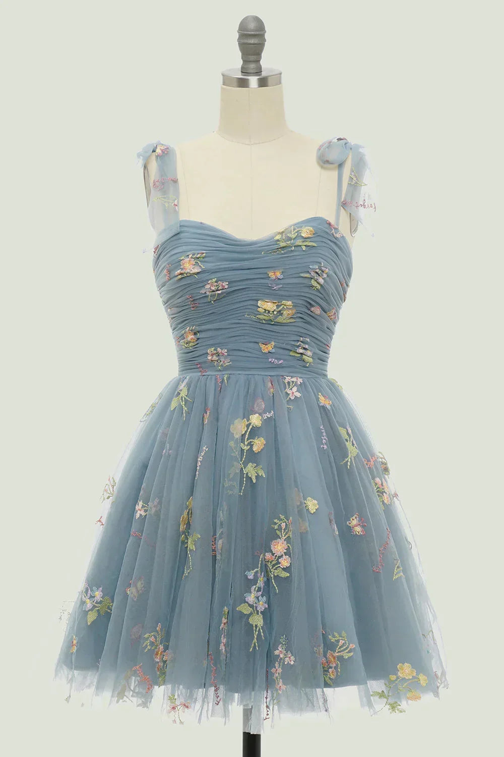Delicate floral embroidered mini dress for women, featuring a chic layered skirt and a sophisticated sweetheart neckline.