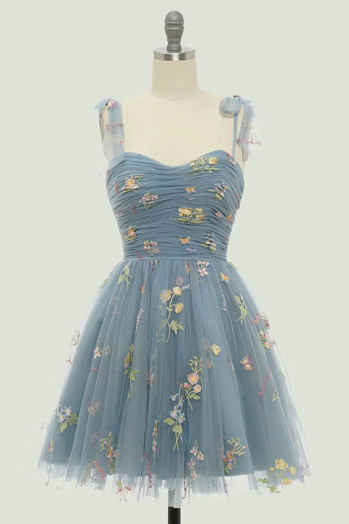 Delicate floral embroidered mini dress for women, featuring a chic layered skirt and a sophisticated sweetheart neckline.