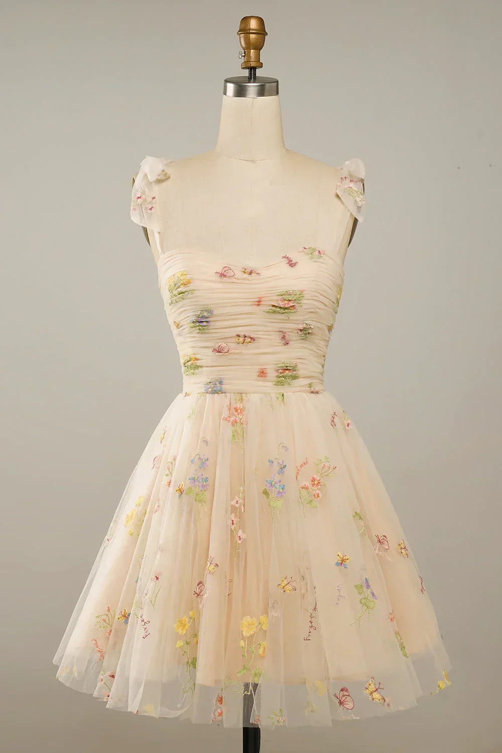 Stylish women's mini dress, sleeveless, with exquisite floral embroidery and a charming layered skirt, great for parties.