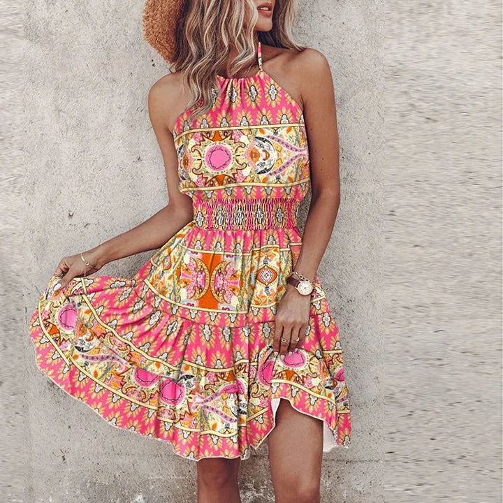 Women's floral flowy halter mini dress with smocked waist, perfect for summer and vacation.