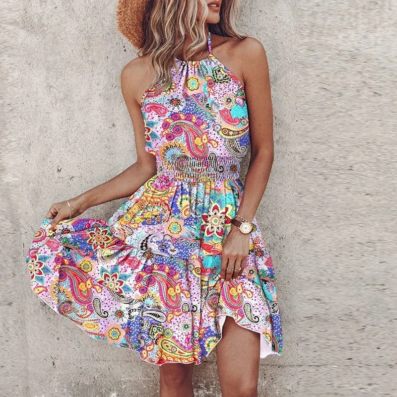 Vibrant floral print women's flowy halter mini dress with flattering smocked waist. Ideal for spring/summer fashion.