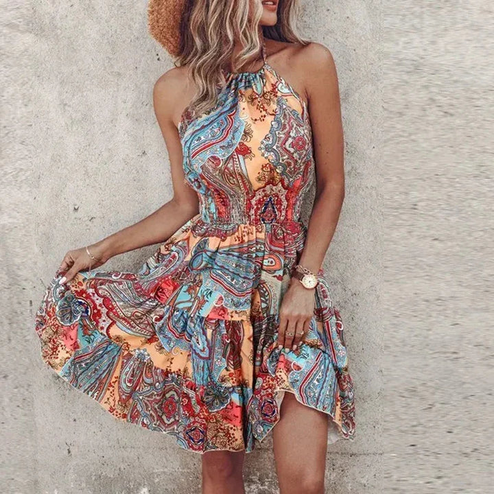 Cute women's floral flowy halter mini dress, ideal vacation or beachwear. Smocked waist for a comfortable fit.