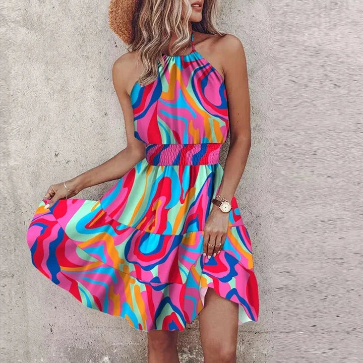Chic women's floral halter mini dress. Flowy silhouette, smocked waist for comfort & style. Versatile summer wear.
