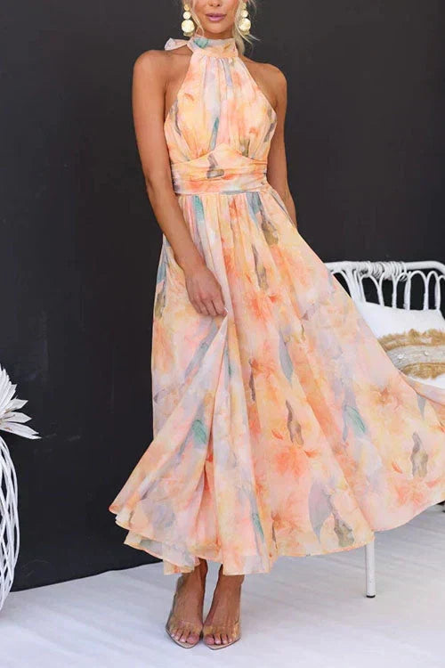 Flowy women's summer floral maxi dress, a comfortable halter neck sundress for vacation and casual outings.