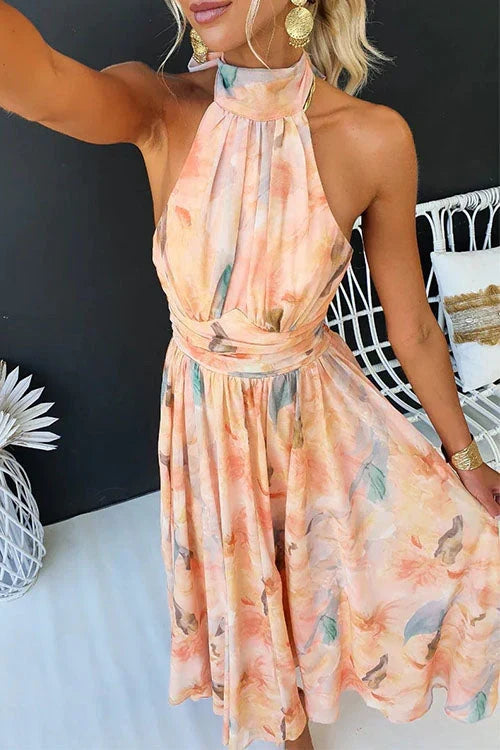 Vibrant floral print halter neck maxi dress, a stylish women's summer sundress for elegant beach or vacation looks.