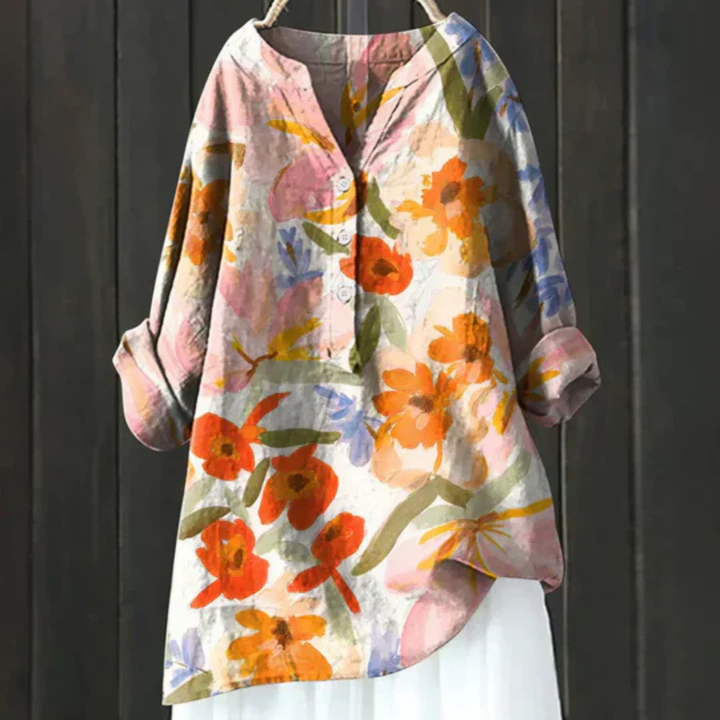 Elegant ladies floral long sleeve V-neck blouse, perfect for spring fashion. Casual, loose fit with vibrant print.