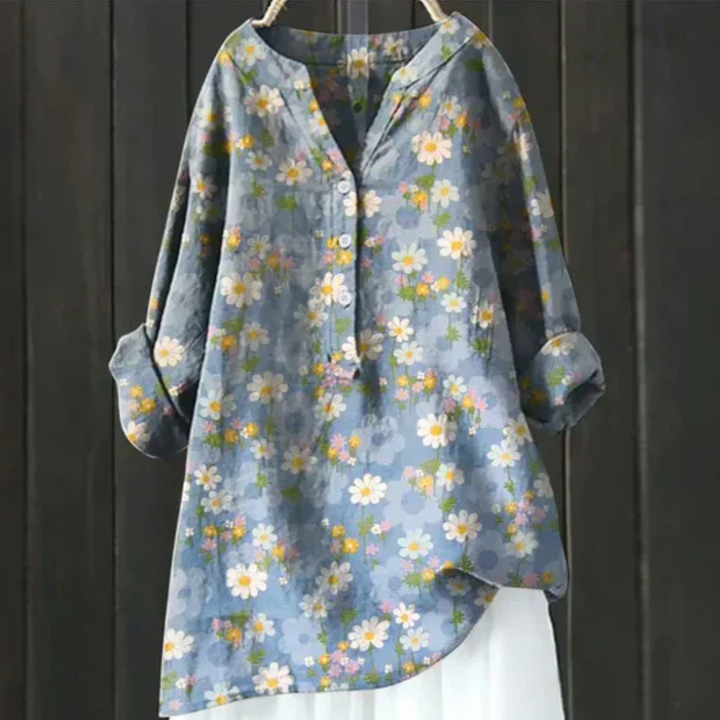 Stylish women's bohemian floral print long sleeve V-neck blouse. Loose fit, button-up, vibrant design.