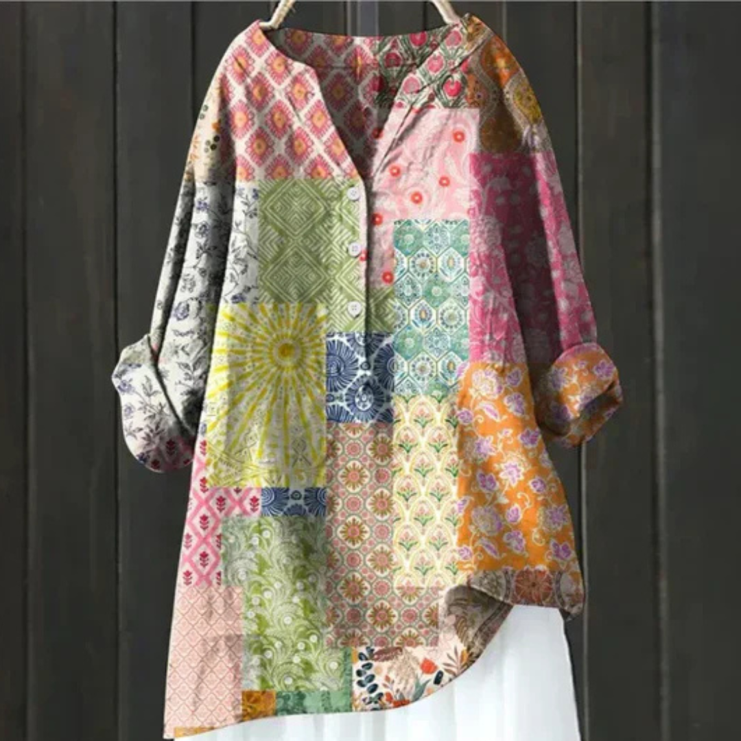 Casual women's long sleeve floral blouse with a V-neck and button-up front. Vibrant spring print, loose fit.