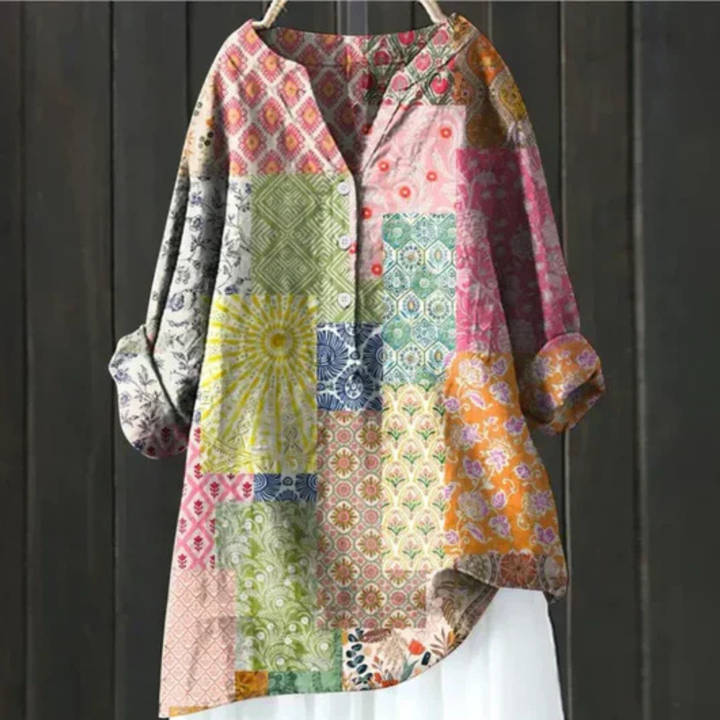 Casual women's long sleeve floral blouse with a V-neck and button-up front. Vibrant spring print, loose fit.