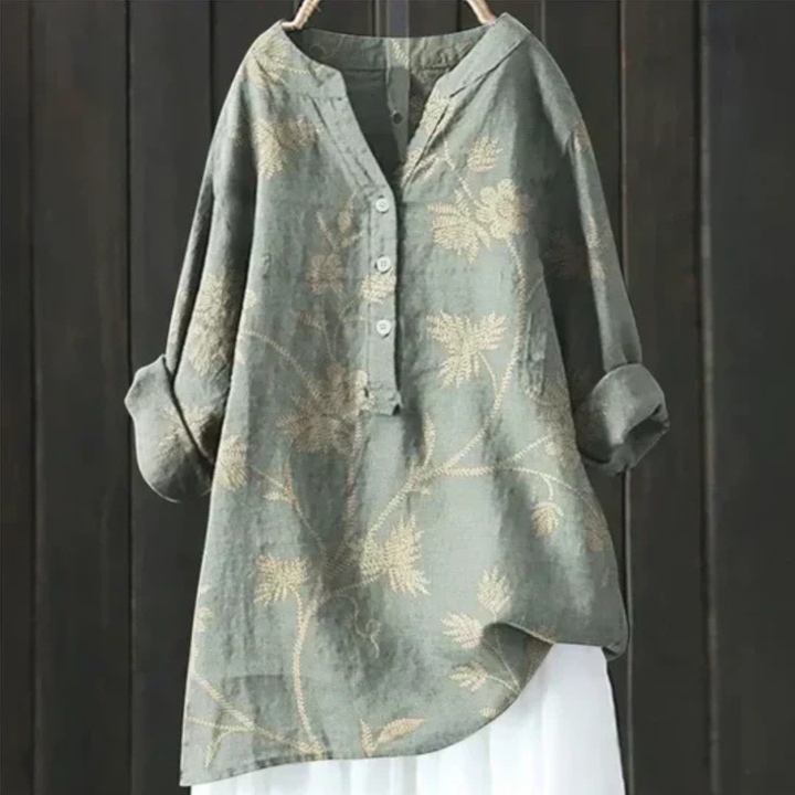 Ladies' stylish floral long sleeve V-neck blouse. Loose fit, button-up, vibrant print. Great for spring/summer.