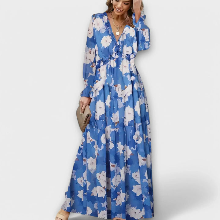 Stylish women's floral maxi dress, V-neck & tiered skirt design. Ideal for casual spring/summer day wear.