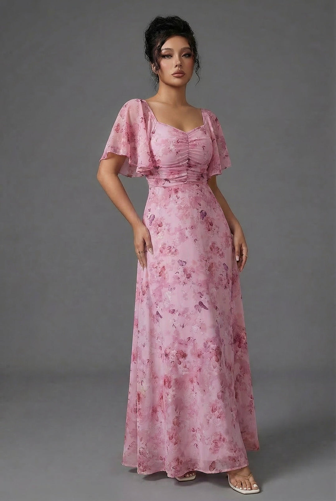 Beautiful women's floral print maxi dress with flutter sleeves and a sweetheart neckline for formal events.