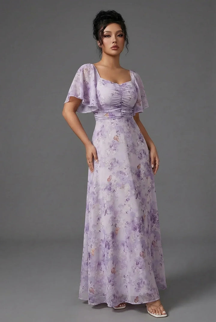 Stylish floral maxi wedding guest dress for women, featuring a flattering silhouette and delicate flutter sleeves.