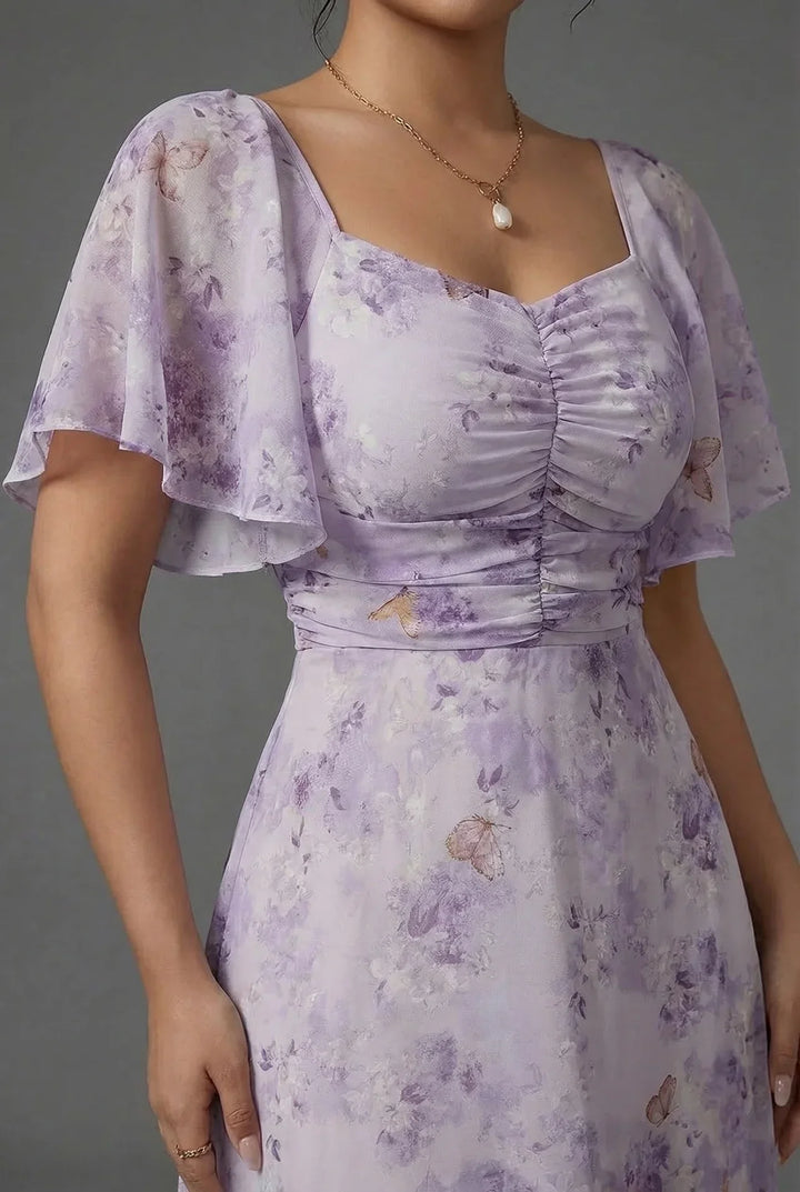 Sweetheart neckline floral maxi dress with flutter sleeves, an elegant choice for wedding guests and summer parties.