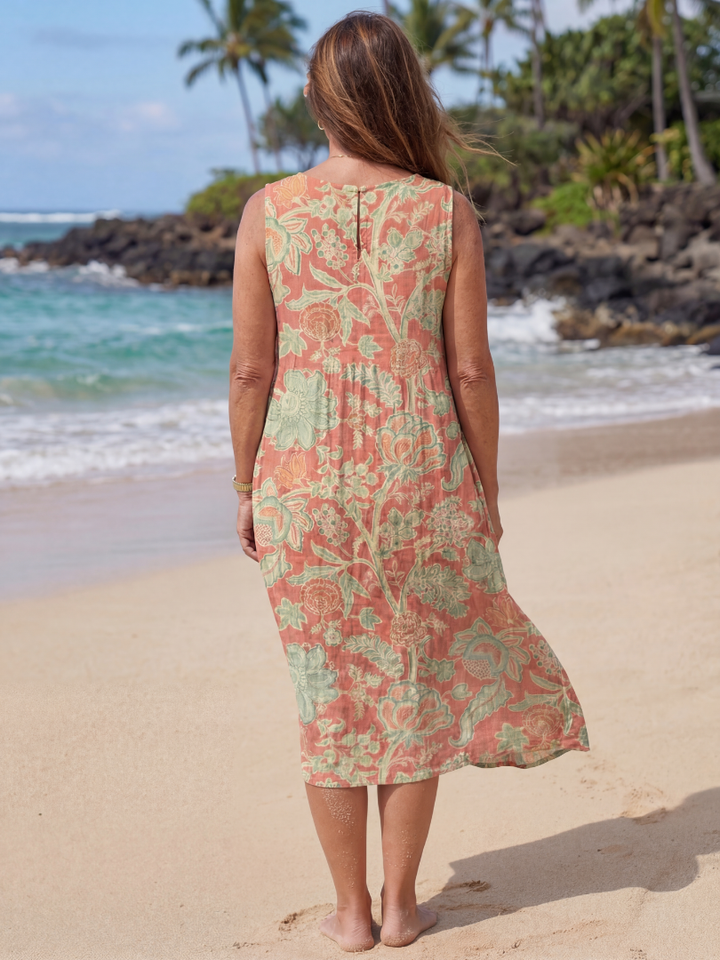 Flowy women's floral midi dress, ideal for summer fashion, beach trips, and comfortable resort wear.