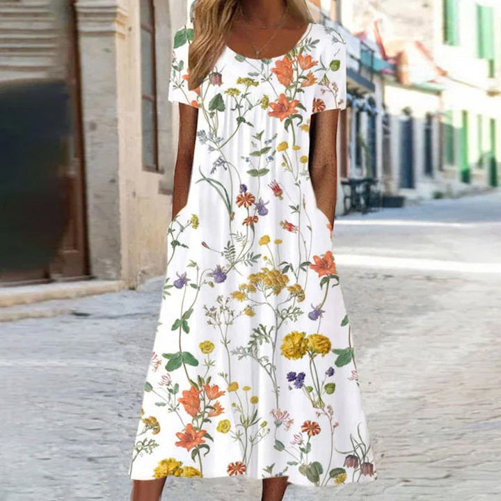 Stylish women's midi dress featuring a vibrant floral print.