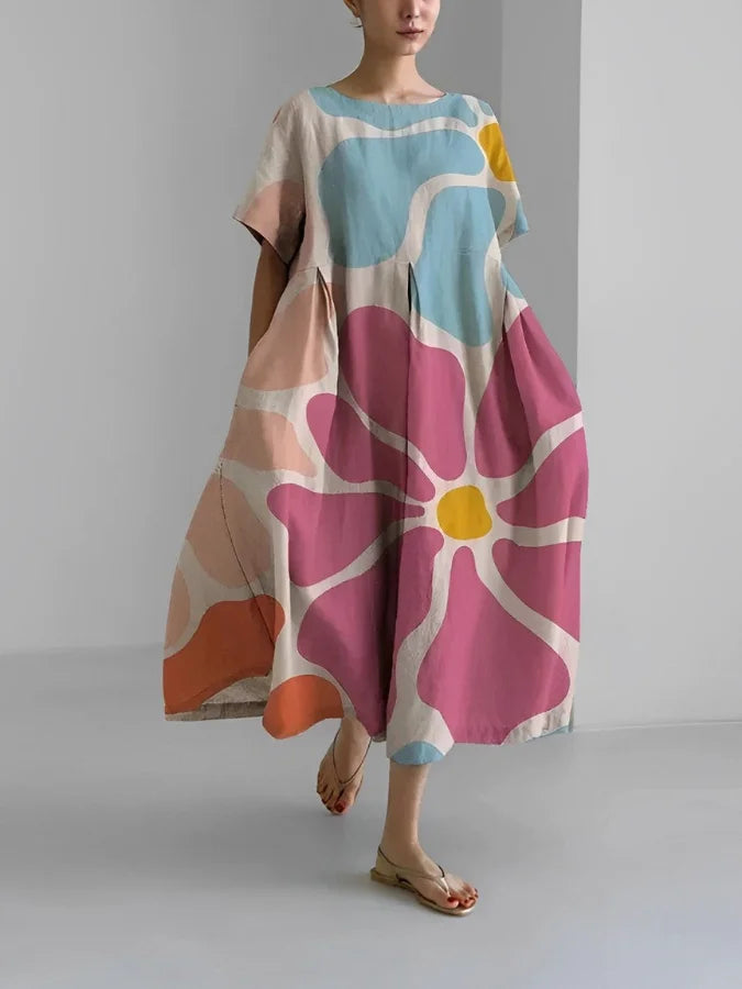 Flowy floral midi dress for women. Effortless summer style, comfortable relaxed fit. Versatile for casual or vacation.