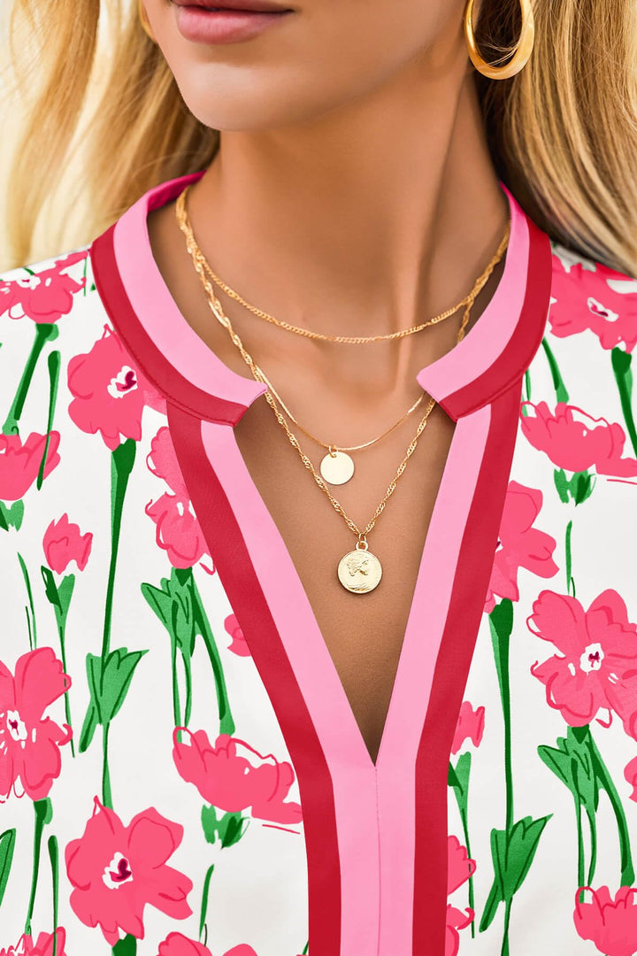 Woman walking confidently in a trendy floral mini dress, puff sleeves swaying, embodying casual boho summer style.
