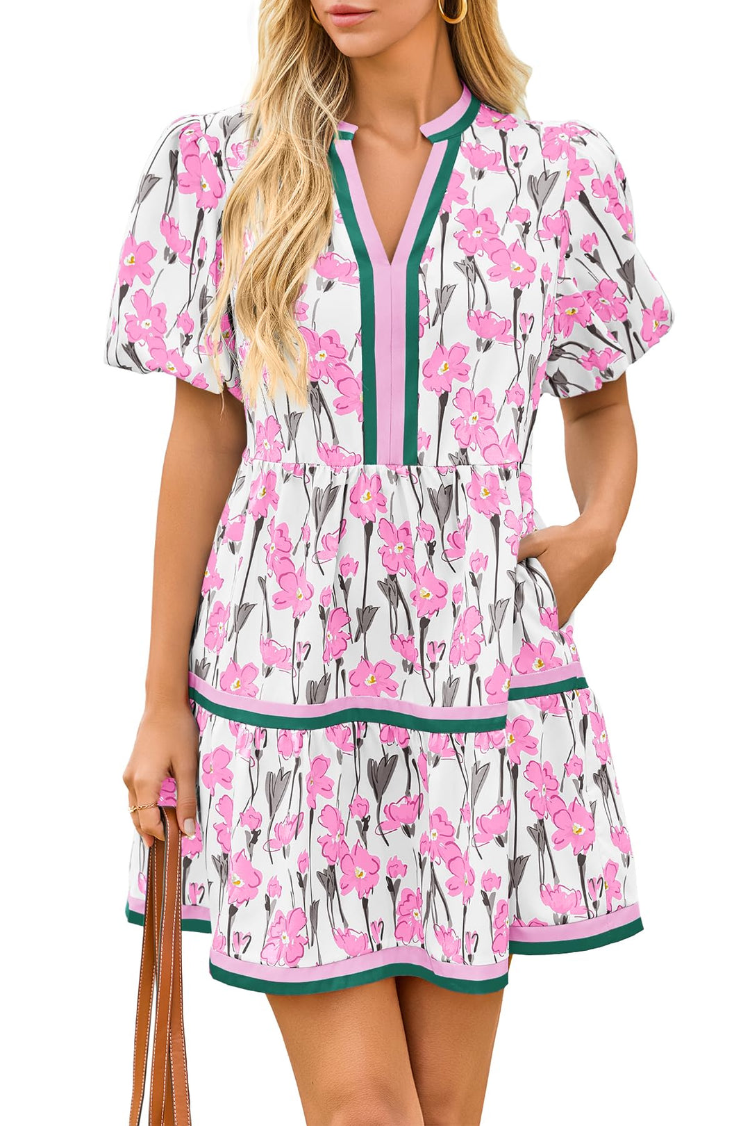 Woman in a vibrant floral mini dress with puff sleeves, enjoying a casual boho chic summer day. Trendy & comfy.