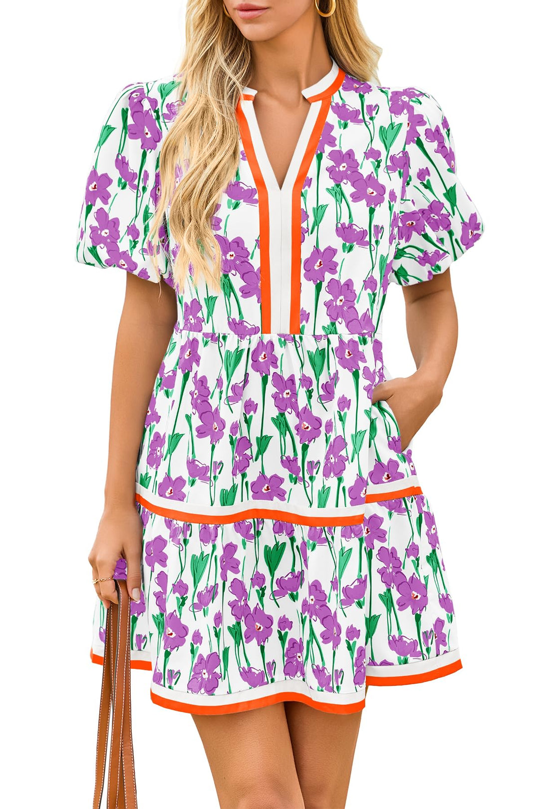 Close-up of the intricate floral patchwork fabric on a women's boho mini dress with stylish puff sleeves.