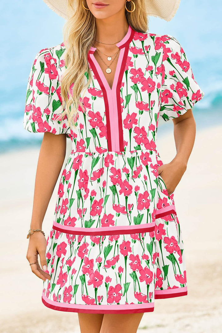 Distinctive puff sleeves on a women's floral V-neck mini dress, offering a trendy boho summer look.