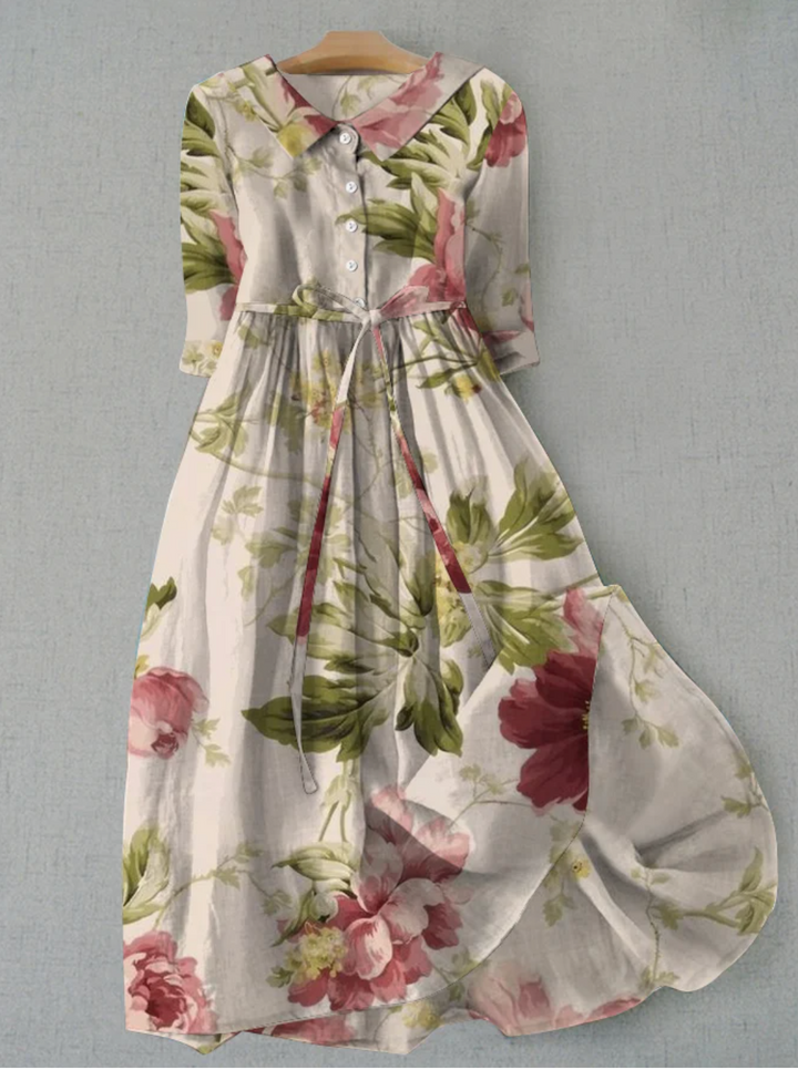 Women's floral patterned button-down midi dress with a stylish tie waist, perfect for summer.