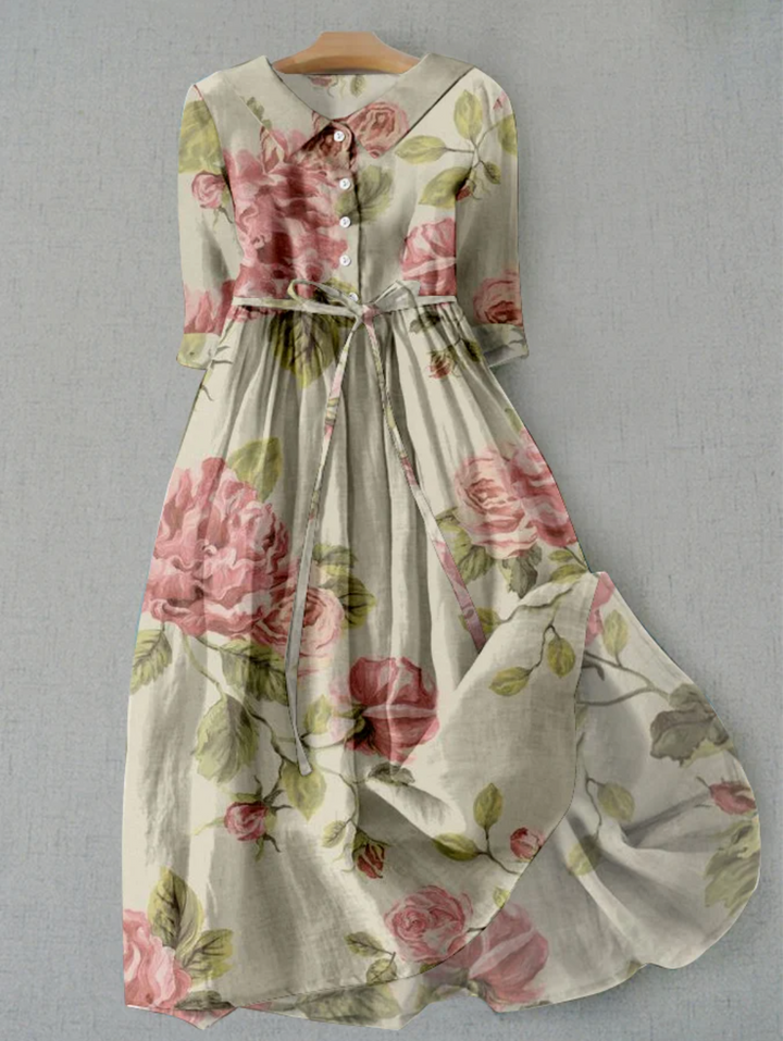 Feminine floral print midi dress with full button-down front & tie waist, comfortable and chic for events.