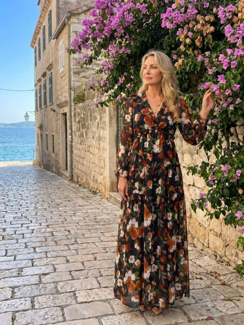Model wearing a women's floral print long sleeve tiered maxi dress, relaxed and flowy.