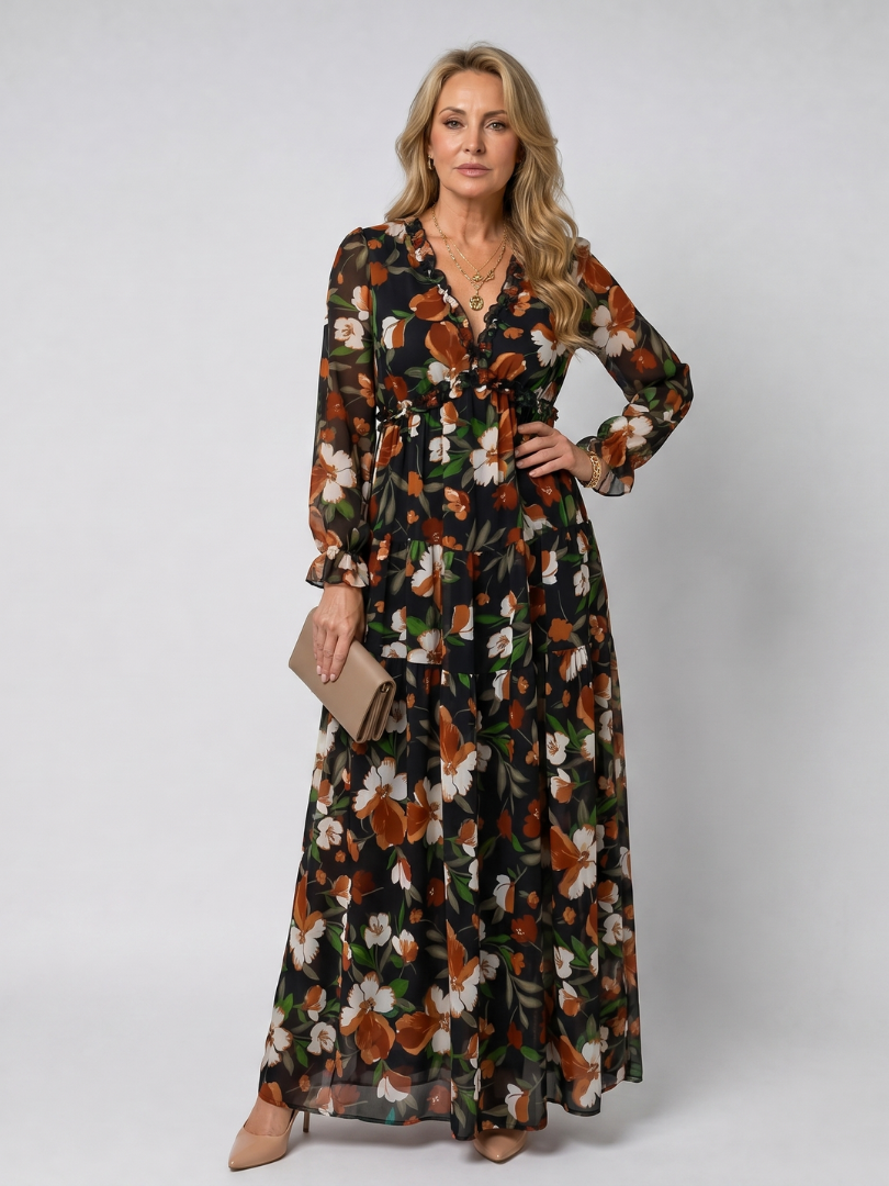 Full length view of a women's floral long sleeve tiered maxi dress, comfortable and stylish.