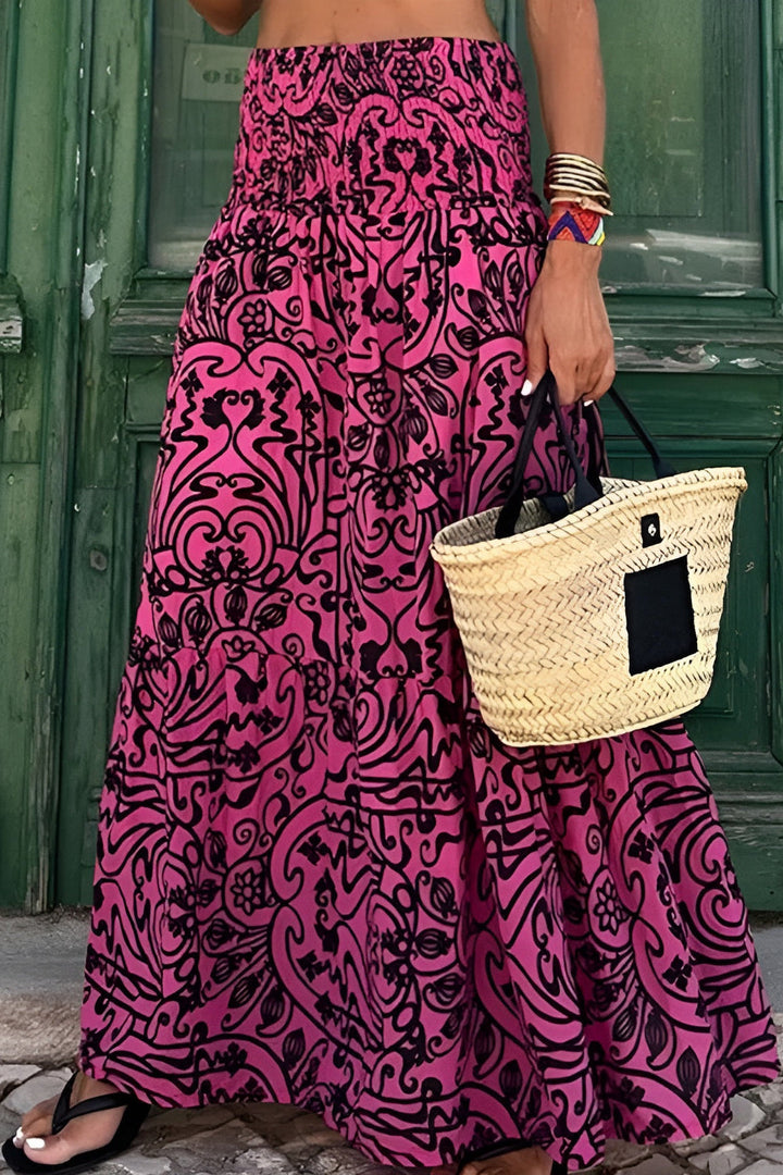 Elegant women's flowy floral maxi skirt with comfortable smocked waist, perfect for spring fashion.