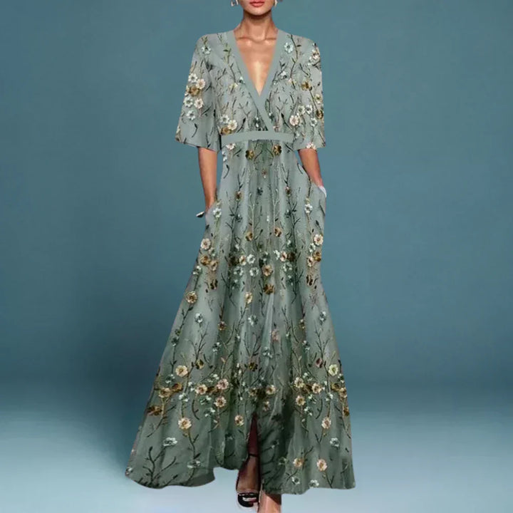 Women's floral print maxi wrap dress with V-neck, elegant flowy design & thigh slit. Perfect for summer parties.