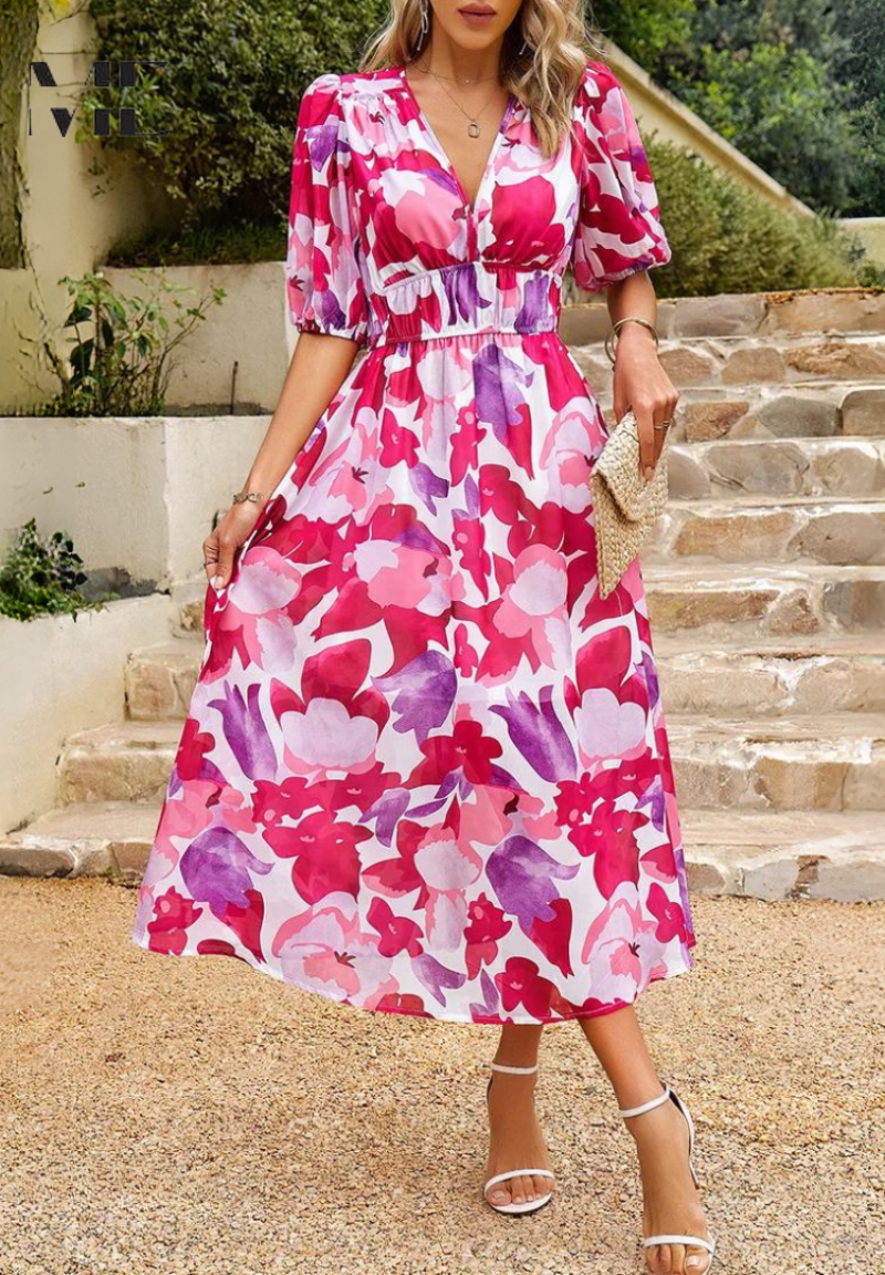 A women's V-neck floral midi dress, highlighting its flattering silhouette and print.