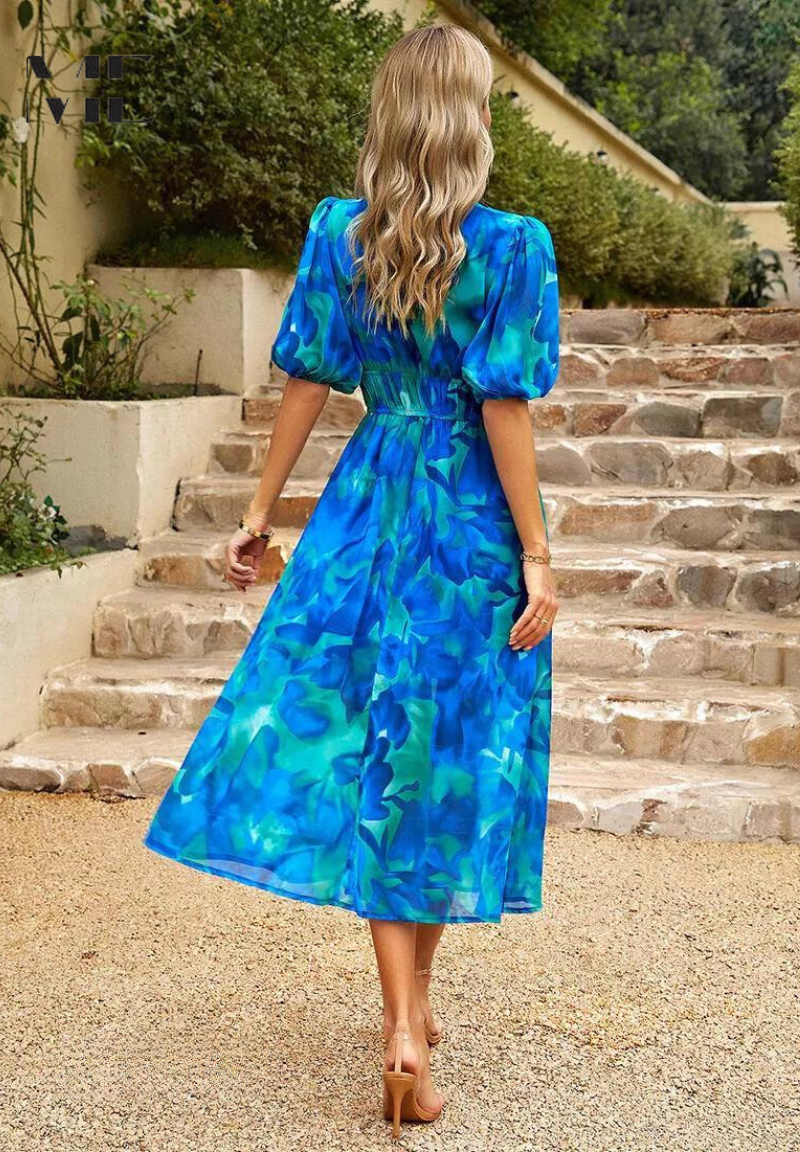 Casual women's floral midi dress, short sleeve, V-neck, perfect for a sunny day out.