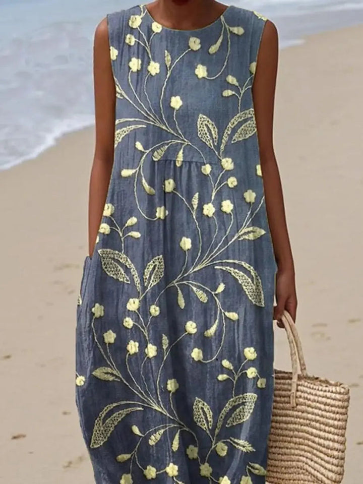 Relaxed fit women's sleeveless floral print midi dress, perfect for spring fashion, summer holidays, or casual wear.