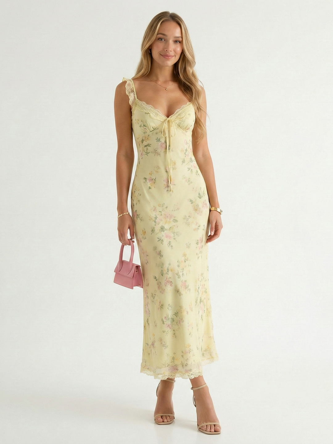 Women's floral print midi dress with delicate spaghetti straps and a chic backless design, perfect for summer.
