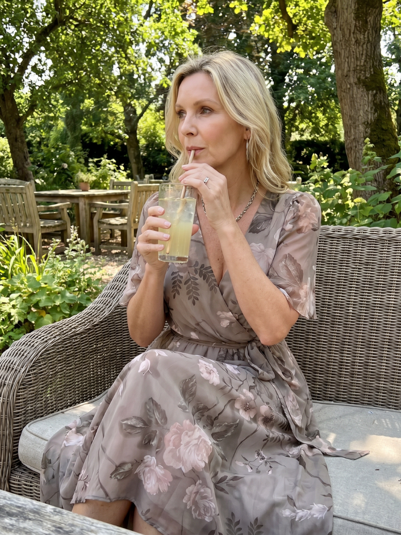Stylish women's floral midi dress, v-neck, flowy skirt, & playful flutter sleeves for any occasion.